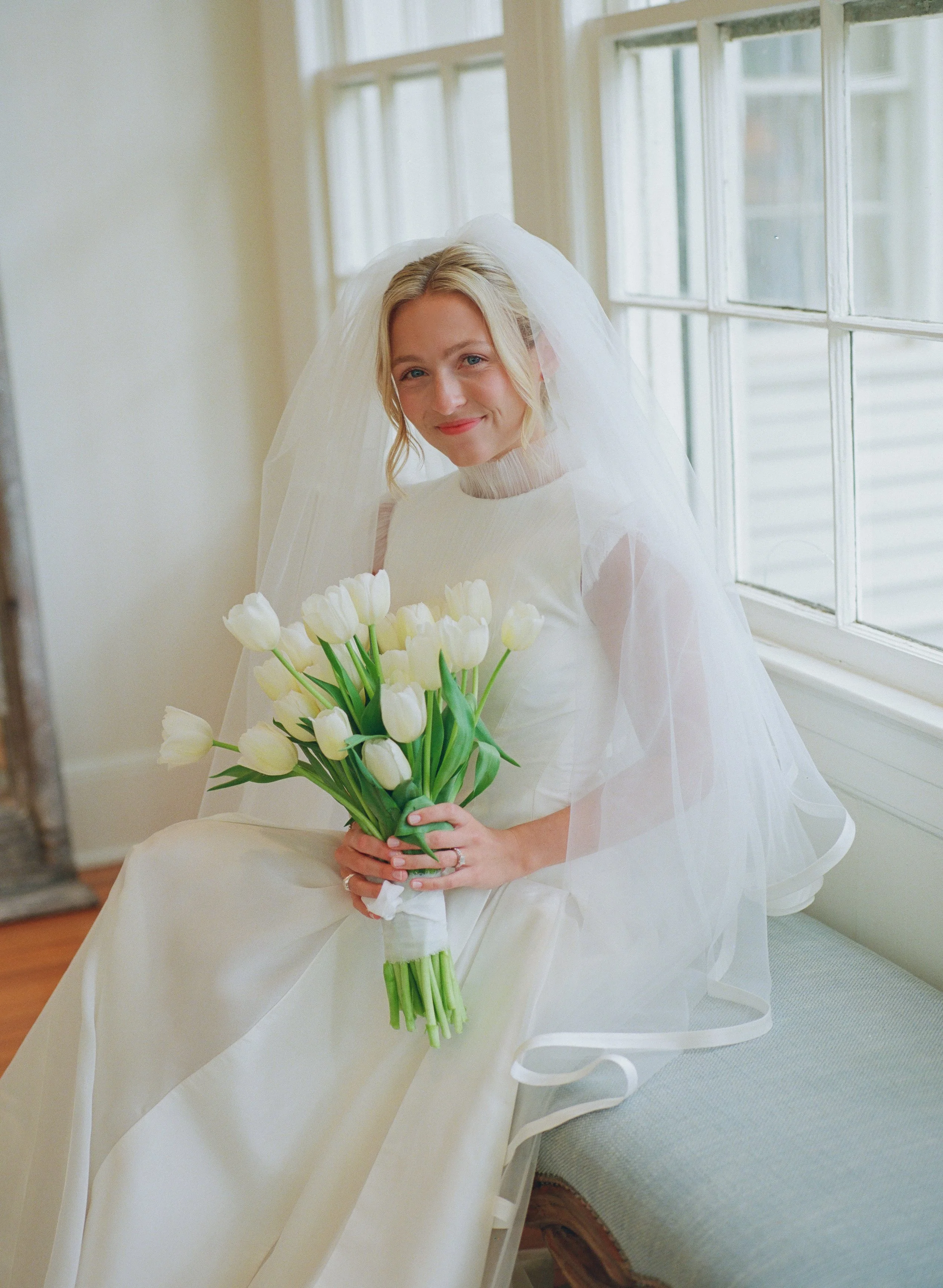 McKlane Bentley in a romantic bespoke silk wedding gown by NiEl Bridal Atelier, crafted from 100% Silk Shantung and 100% Silk Organza in Birmingham, Alabama.