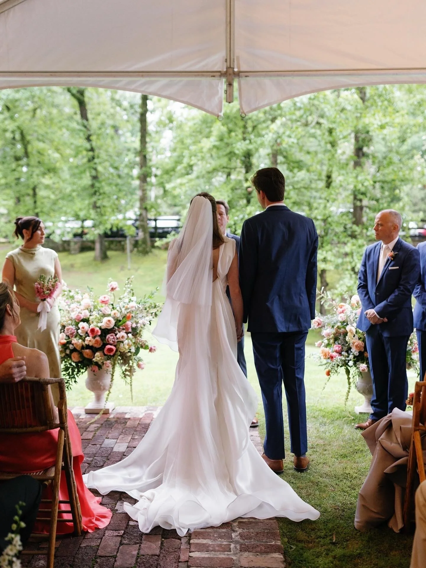 Bride wearing a silk wedding dress by NiEl Bridal Atelier.jpeg