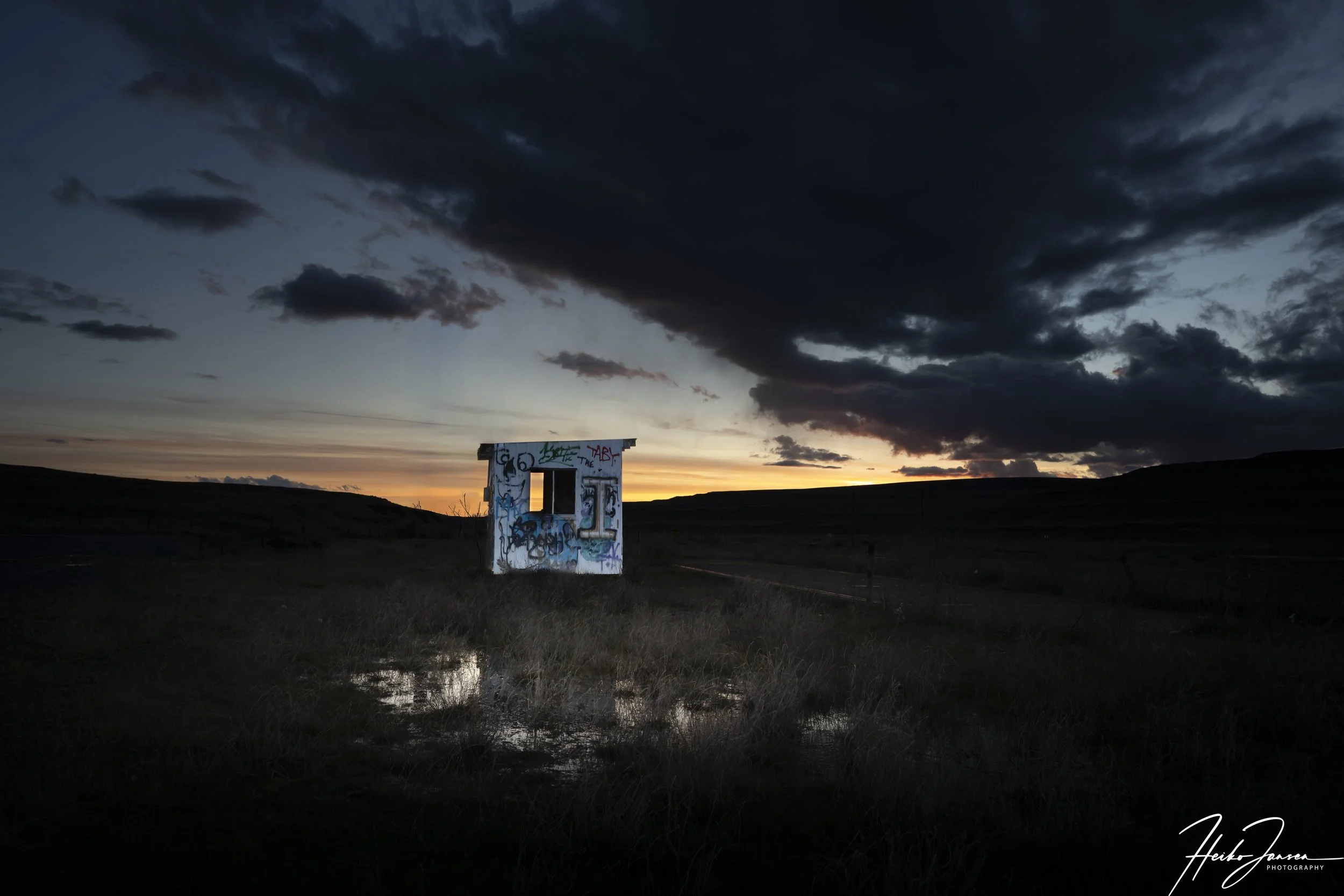 Abandoned structure with graffiti at sunset. 

Nikon Z6iii, Nikkor Z 14-24mm, f2.8 S. 24mm, 1/80 sec, f7.1, ISO 100, 0 EV.
