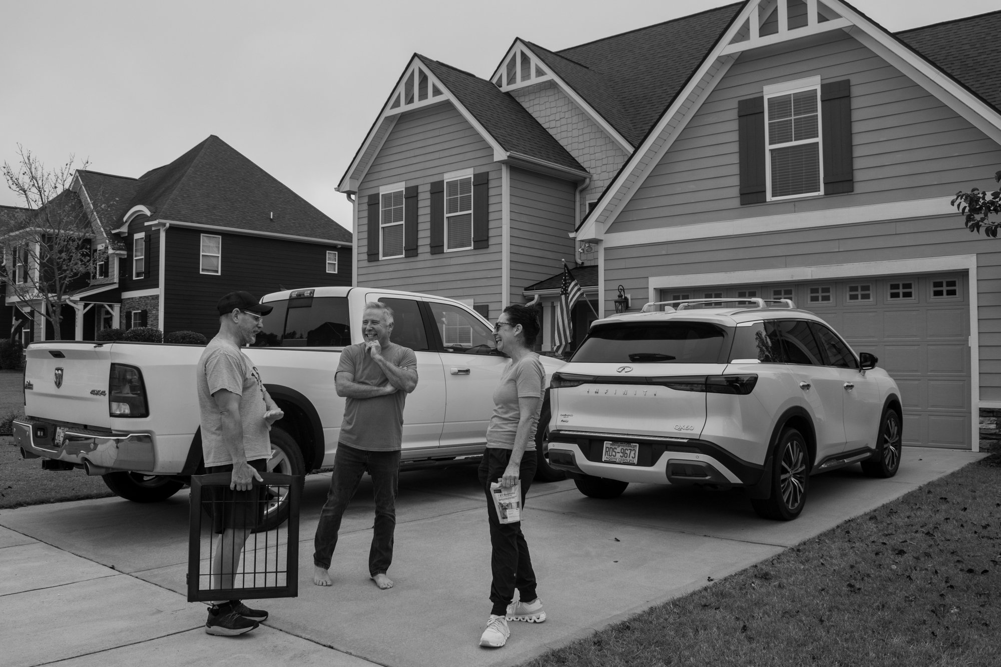 Tina talks with Duane and her neighbor, Craig Munnings, outside her house in Fuquay-Varina, North Carolina. Aside from her friends, Tina leans on her husband for support. Duane said they have a strong relationship and have been married for 30 years. 