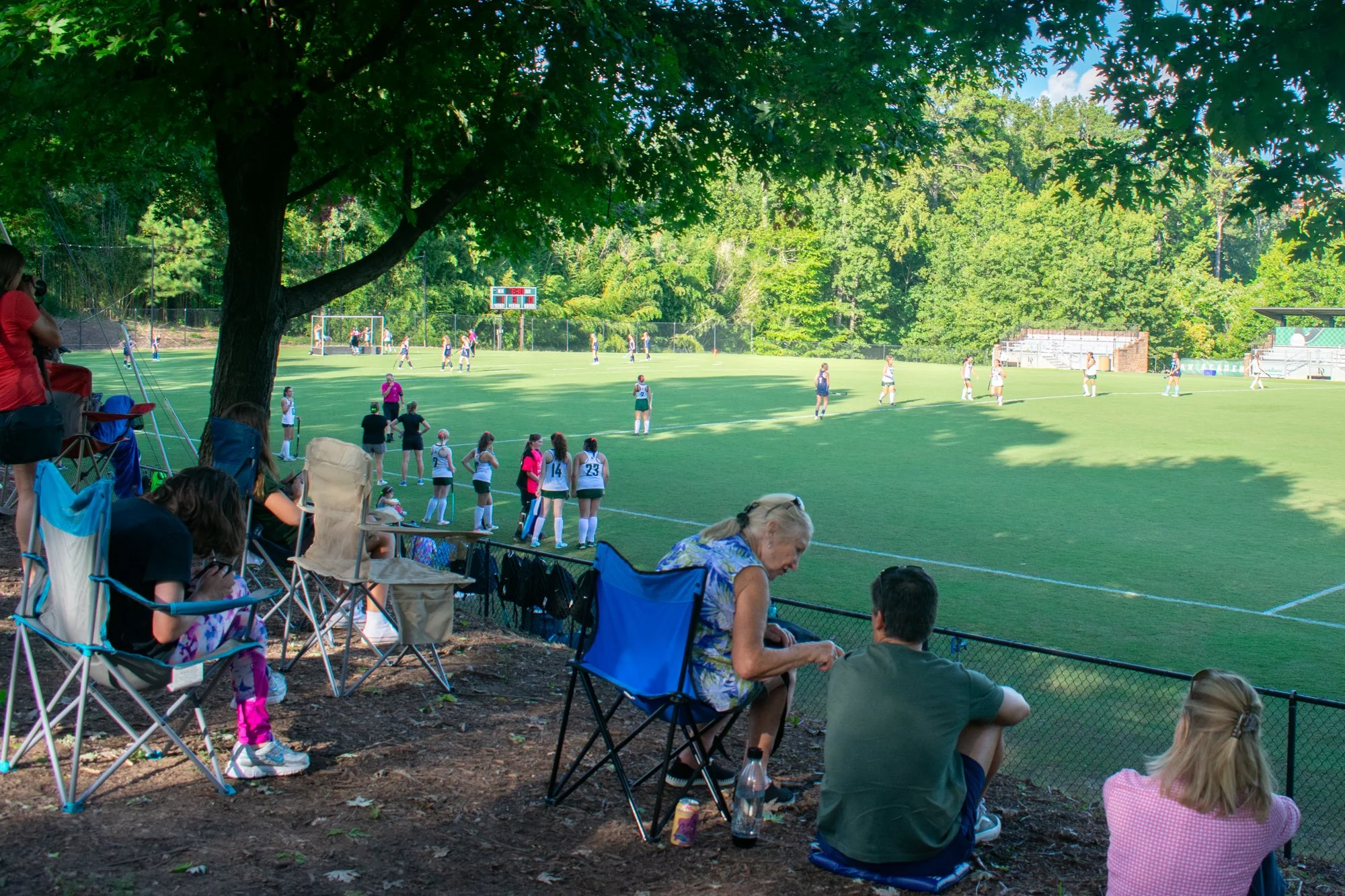 Fans and families watch the field hockey team play against Cary Academy. “We had a good parent following, which was awesome,” Supica said. “It made us feel really supported. Our crew grew throughout the season, and our parents were always at the game