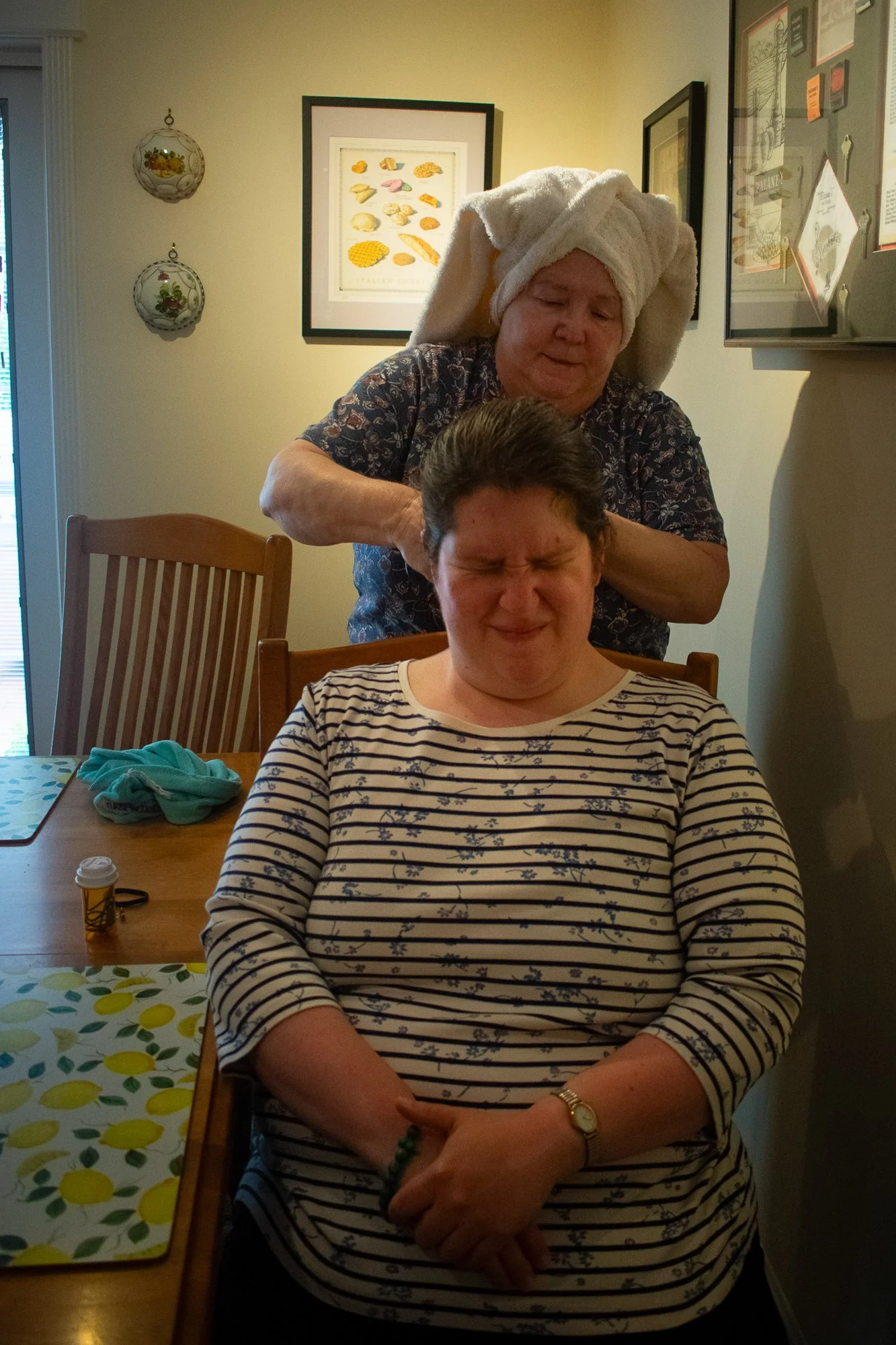 Marge combs Andrea’s hair before work on Monday, June 2. 

Marge said she and Leo are proud of Andrea’s independence. They can now leave her home alone for errands, and she’s able to go to the store by herself. Their next goal is to take an overnight