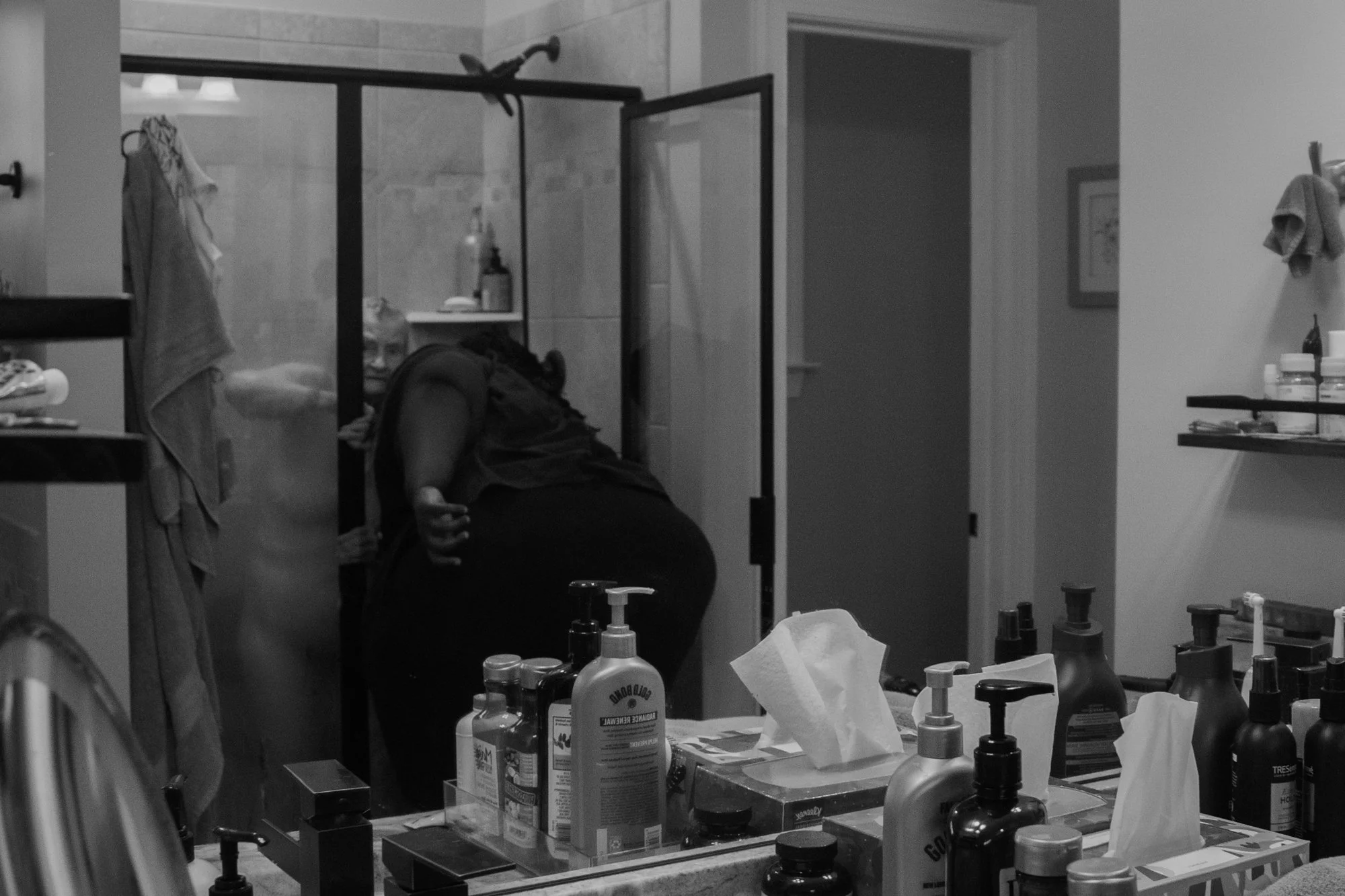 Andrellea McNeil, Mary’s hospice nurse, gives her a shower. Andrellea works for Transitions LifeCare and has been bathing Mary for eight months. Every Wednesday and Friday, Andrellea helps Mary out of bed and wheels her to the shower. In the shower, 