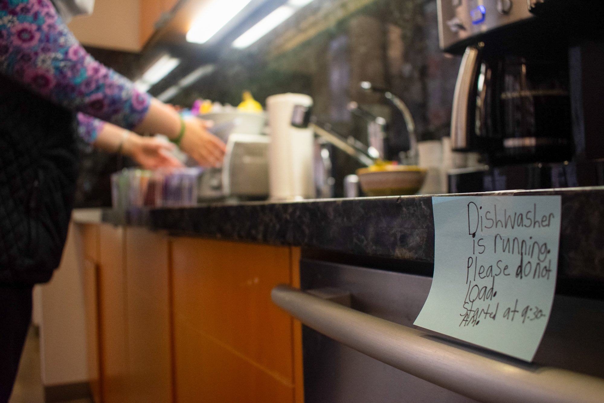 Andrea starts the dishwasher and organizes snacks at Terreno on Tuesday, June 3. Her job includes managing inventory for office and kitchen supplies, running the dishwasher and handling mail. She works Monday through Thursday from 10 a.m. to 12:30 p.