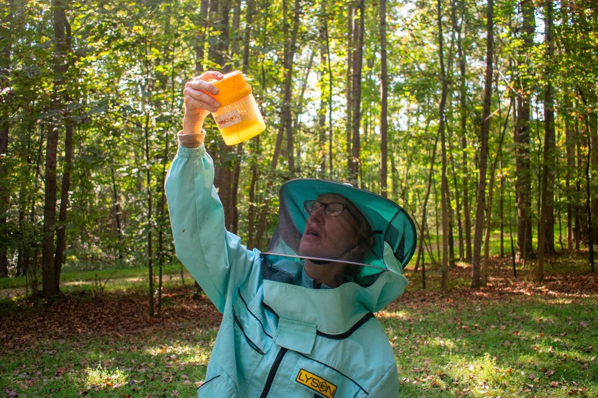 Vogel checks the alcohol wash for any mites that have fallen off the bees. Vogel said she treats for mites four times a year, calling it “a big deal.” She currently has eight hives.

“The mites are the thing that probably kills bees more than anythin