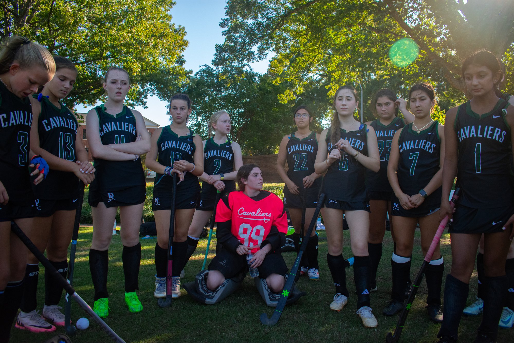 The Durham Academy varsity girls field hockey team huddles together before they play Saint Mary’s School in Raleigh, North Carolina, beating them four to one. The team’s goal for the 2024 season was to build a culture that was based on consistency, i