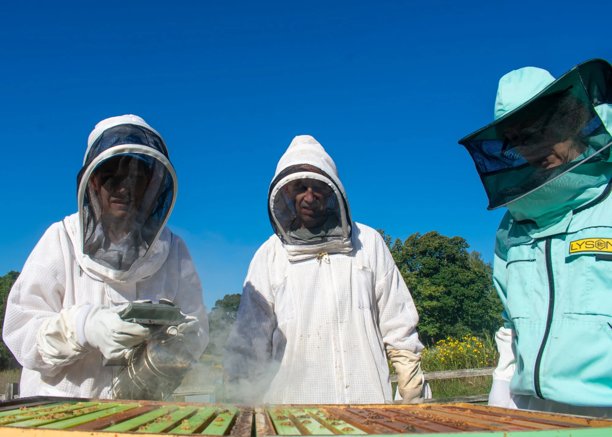 The beekeepers prepare to inspect the box hive by smoking it at Blackwood Farm Park. Kosiba said there are community events at Blackwood where everyone can come and help out. Although beekeeping can be a solitary pursuit, he said community events are
