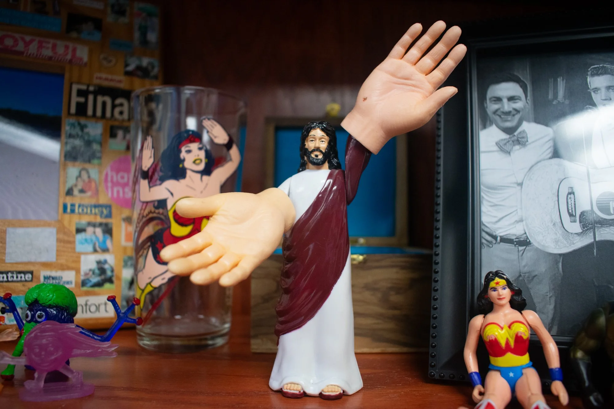 The Jesus action figure was a gift from his sister, and he said it demonstrates a sense of humor that reflects the way he tries to engage with life. Burgess said it shows that while faith is serious, it can get a “little silly” when it falls into hum