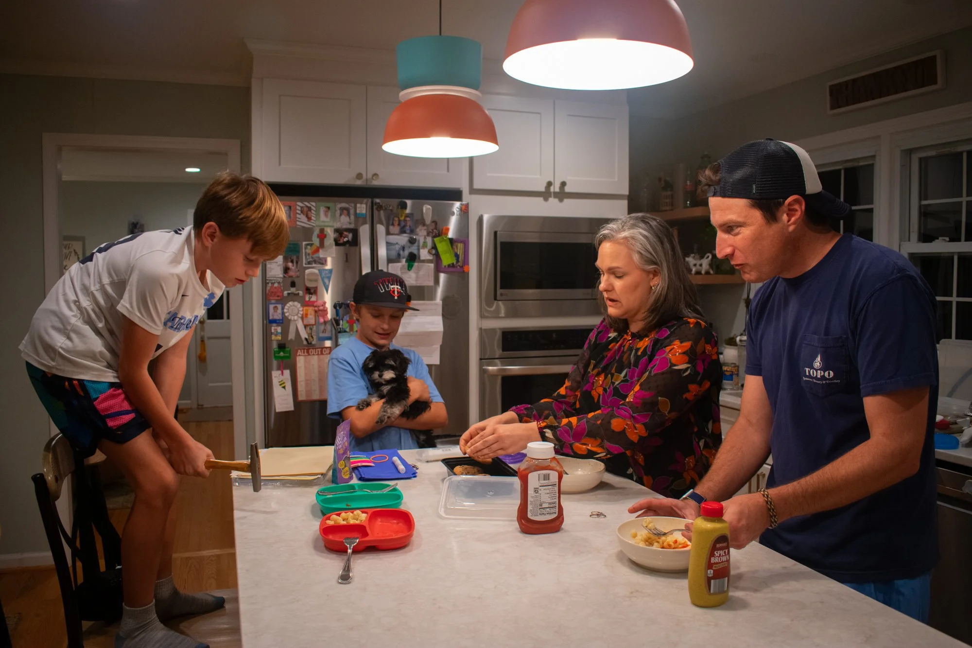 Burgess eats dinner with his wife Liza, his two sons Sawyer and Parrish and their new puppy, Opal. 

He said he weaves faith into his family and the lives of his children by exposing them to regular church involvement, praying together and often talk