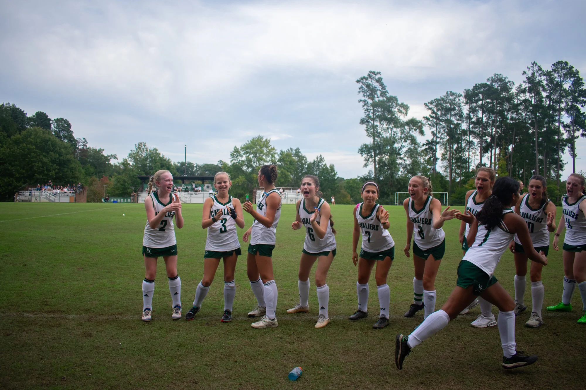 The team high-fives Maya Patel as she runs onto the field after her name is announced. With players spanning all grade levels, their bond is evident both on and off the field as they wholeheartedly support each other. Supica said she wanted the team 