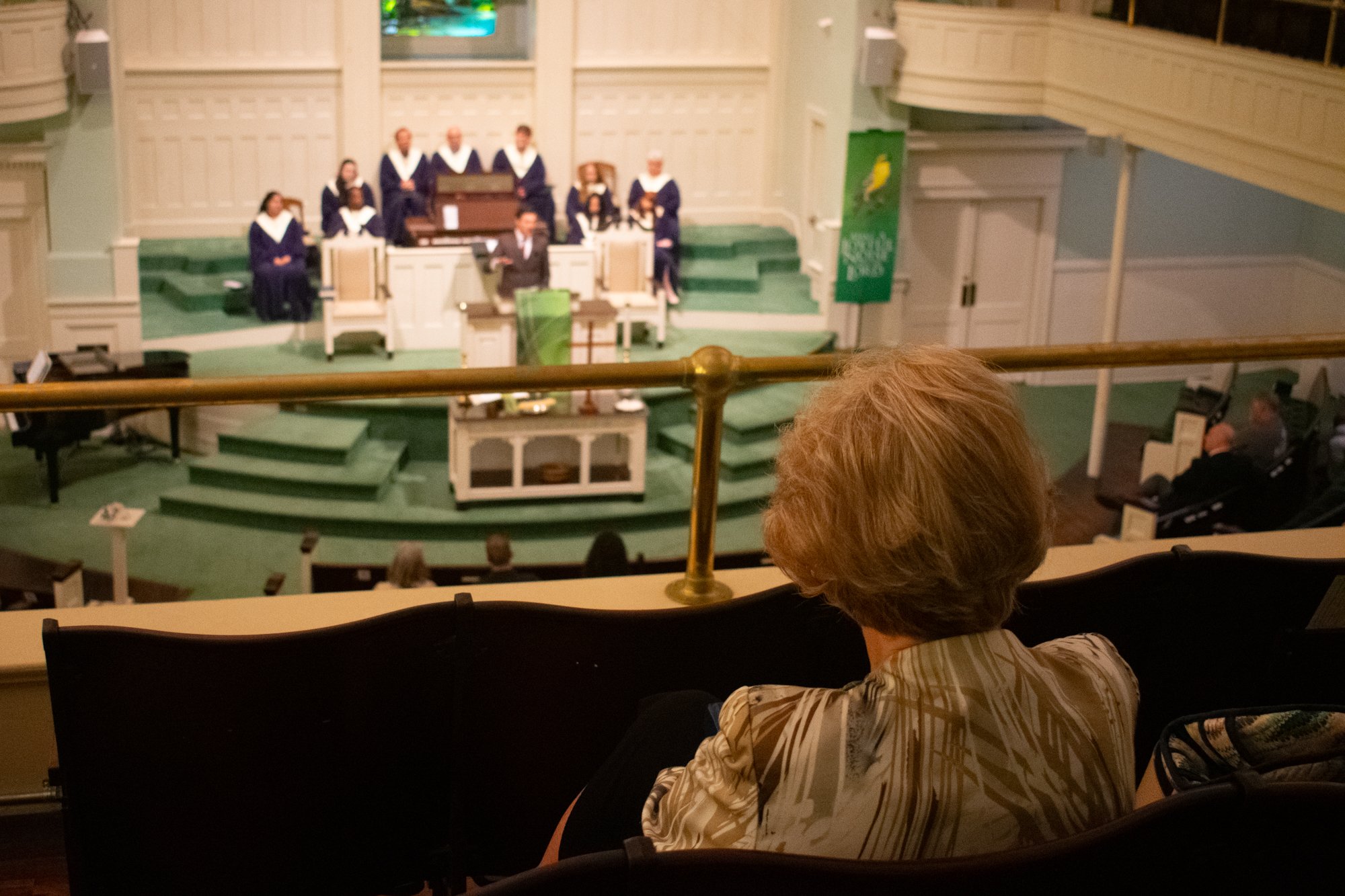 A University Baptist Church member listens to Burgess preach. 

He said religion does all sorts of things for people, as it can be helpful and hopeful but also hurtful. 

“One of the things that concerns me most right now is how people—particularly p