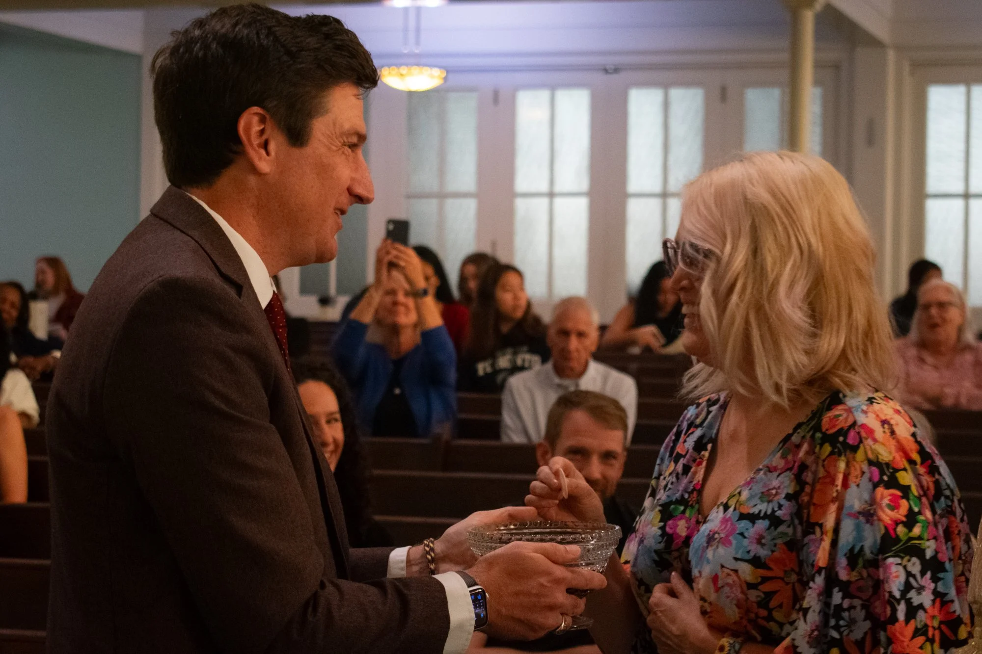 Burgess celebrates World Communion Sunday with a UBC member by serving bread and wine to remember Jesus’ sacrifice during the service. The bread represents Jesus’ body, and the wine his blood. 

“When we do that as people trying to live in His name a