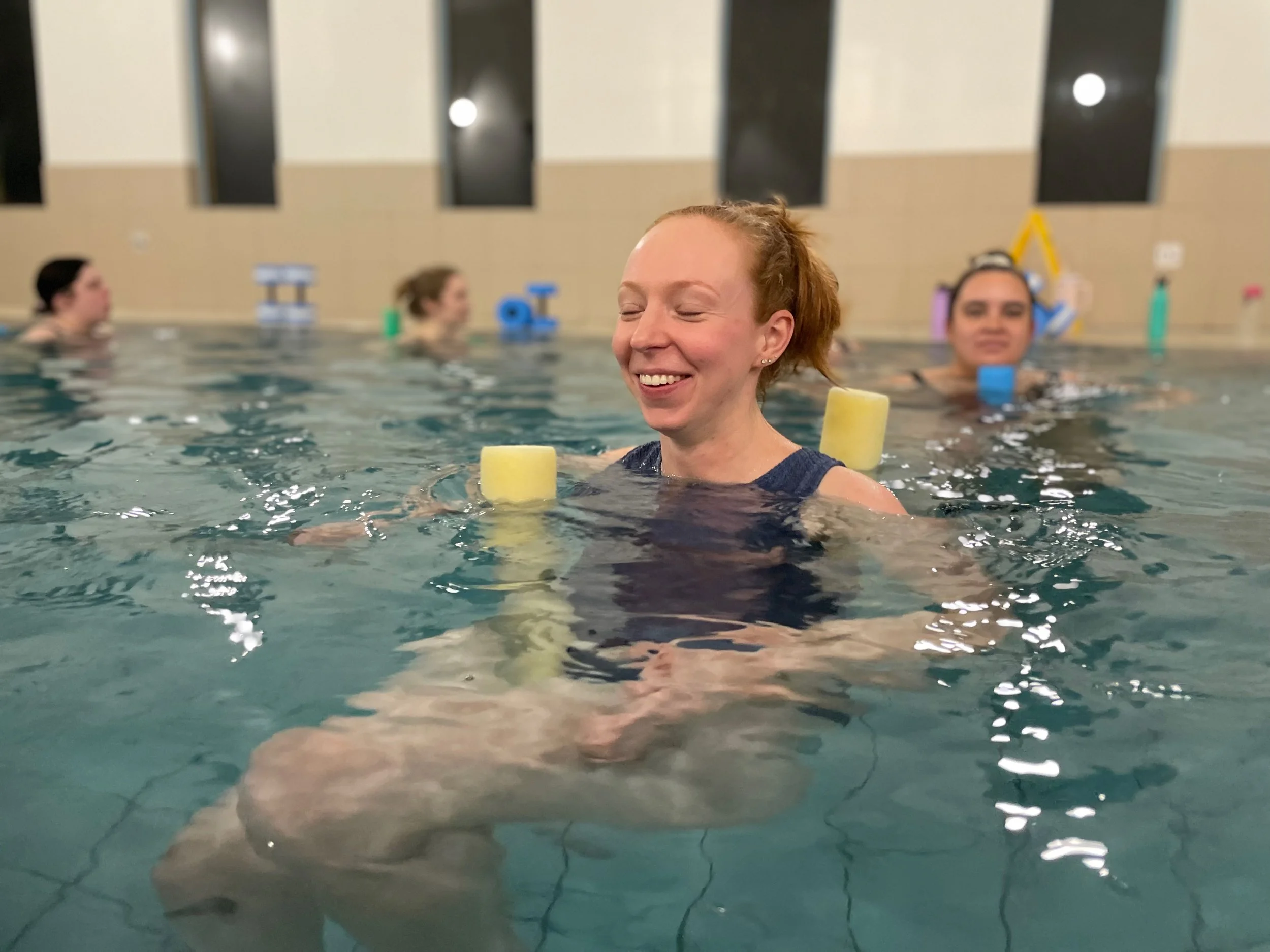 Woman attending prenatal aquatic class