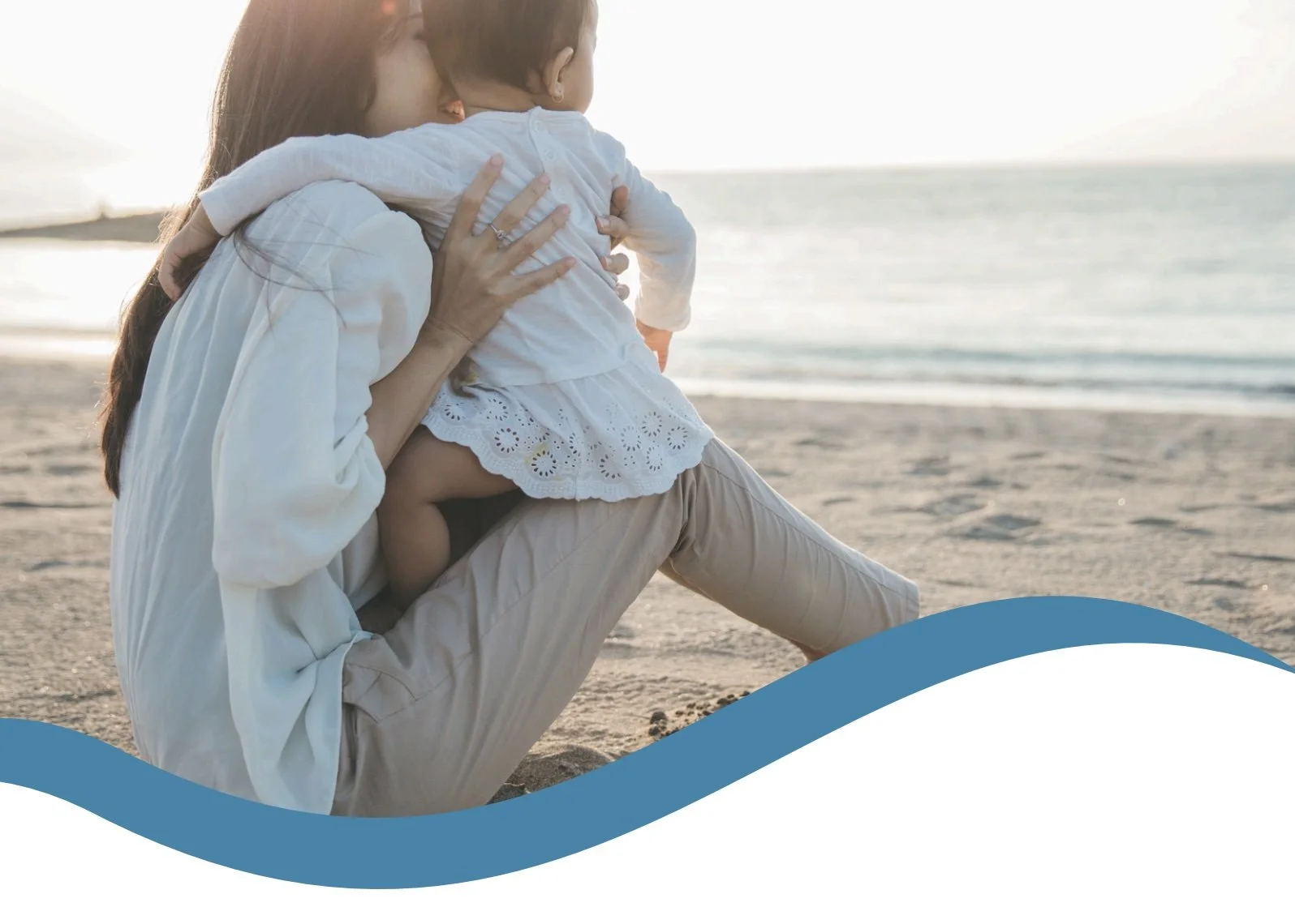 Mother holding child on beach symbolizing reclaiming identity in motherhood