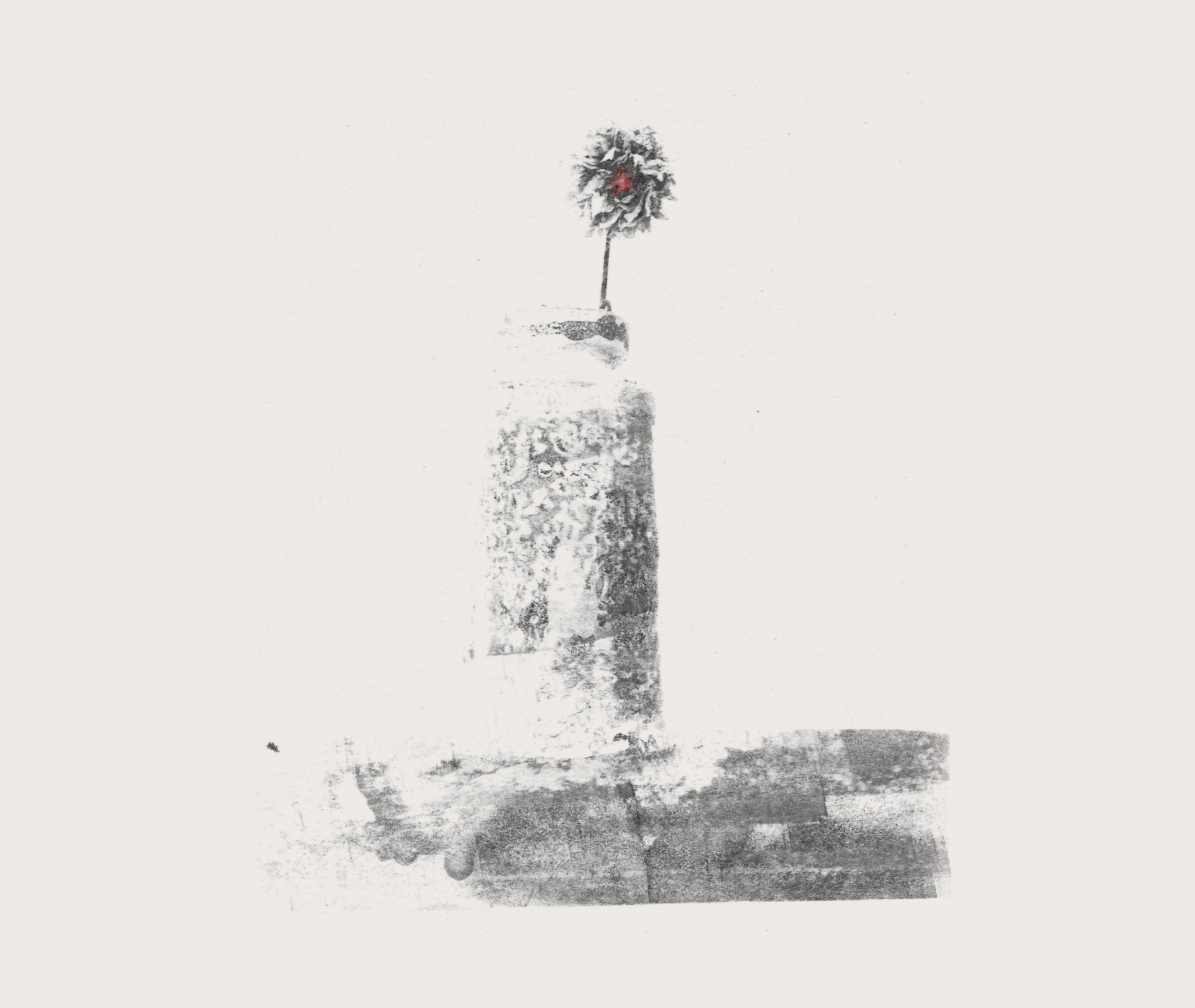 A black and white photo of a tall, narrow structure with a snow-covered umbrella on top, located outdoors in a snowy landscape.