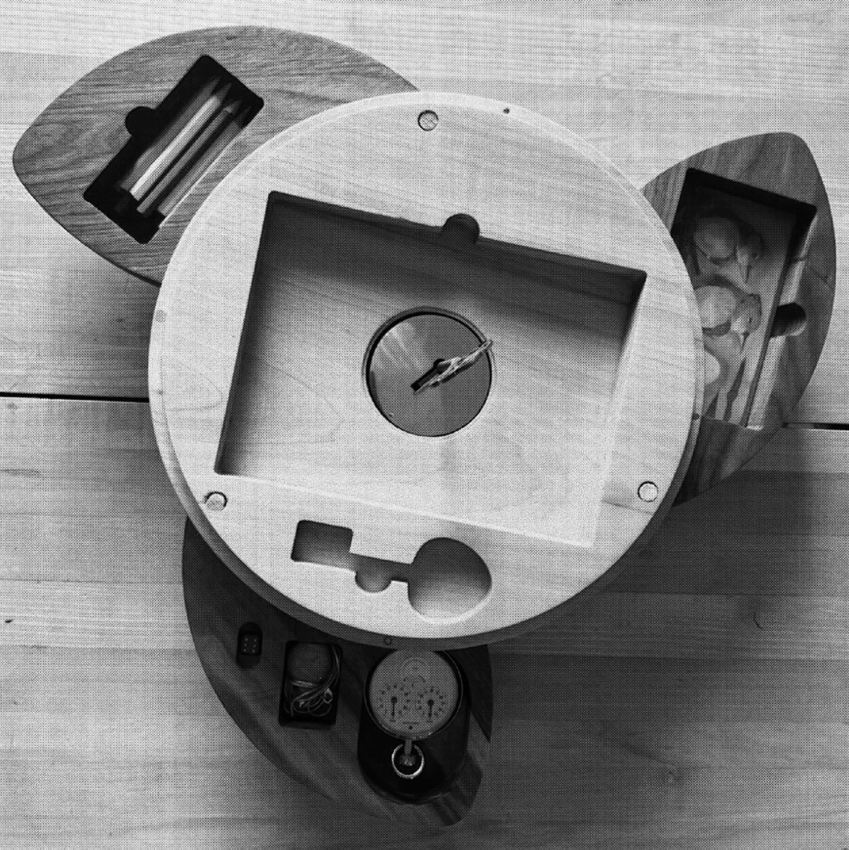 Close-up of the inside of the Marooning Bodies "time capsule", a polished wooden game box and the words 'marooning' and 'bodies' etched on it.