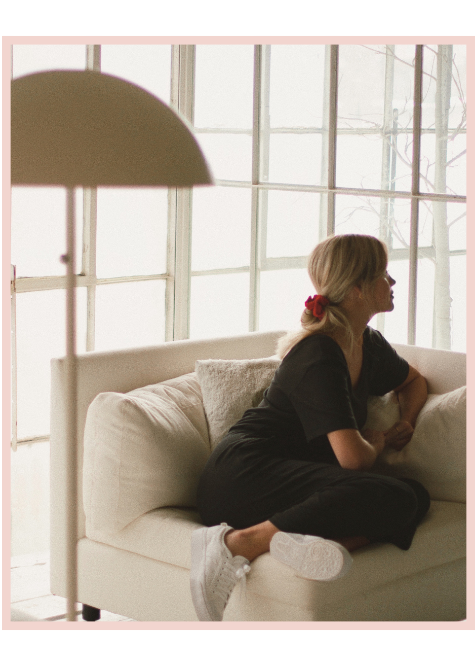 Woman reflecting in a calm, light-filled therapy setting at Meadowbrook Counseling in Athens, Alabama.