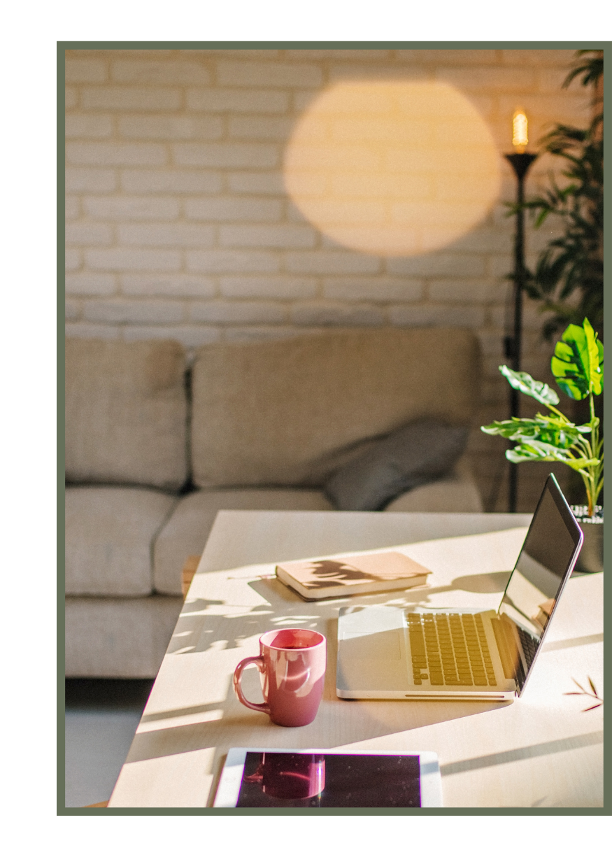 Sunlit counseling office workspace with laptop and notebook at Meadowbrook Counseling in Athens, Alabama.