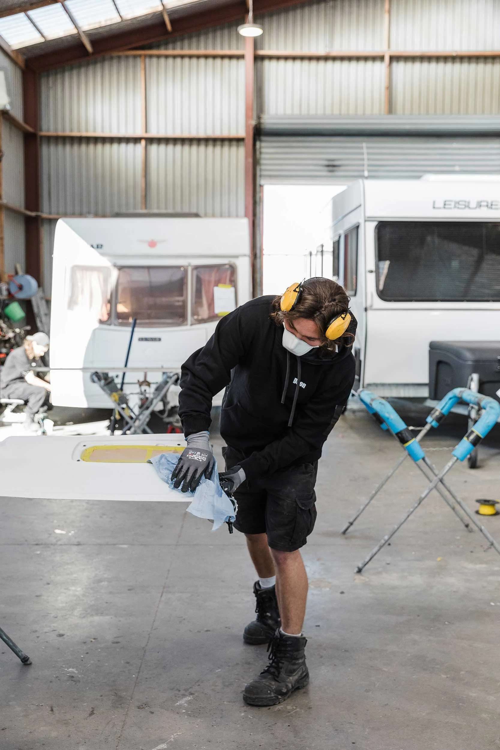 Specialist caravan repairer at A&M Panel Repairs fixing caravan panel after accident damage