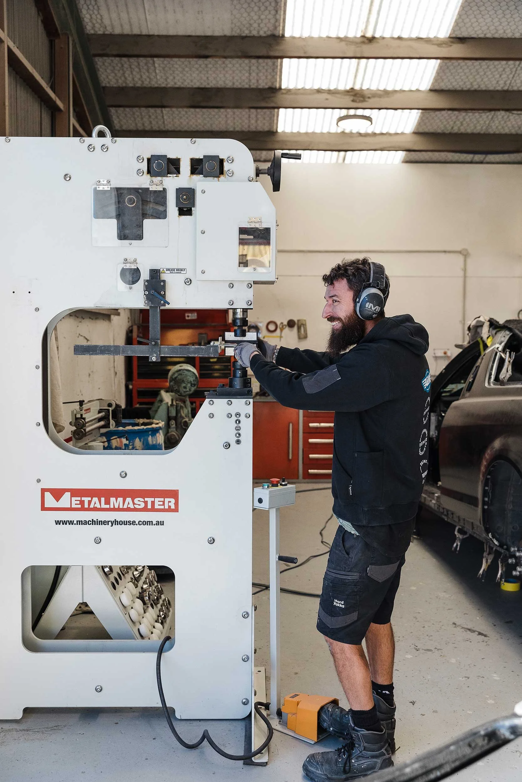 A&M Panel Beater working on custom part fabrication machinery