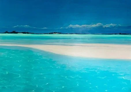 Calm turquoise ocean water near a white sandy beach under a partly cloudy sky.
