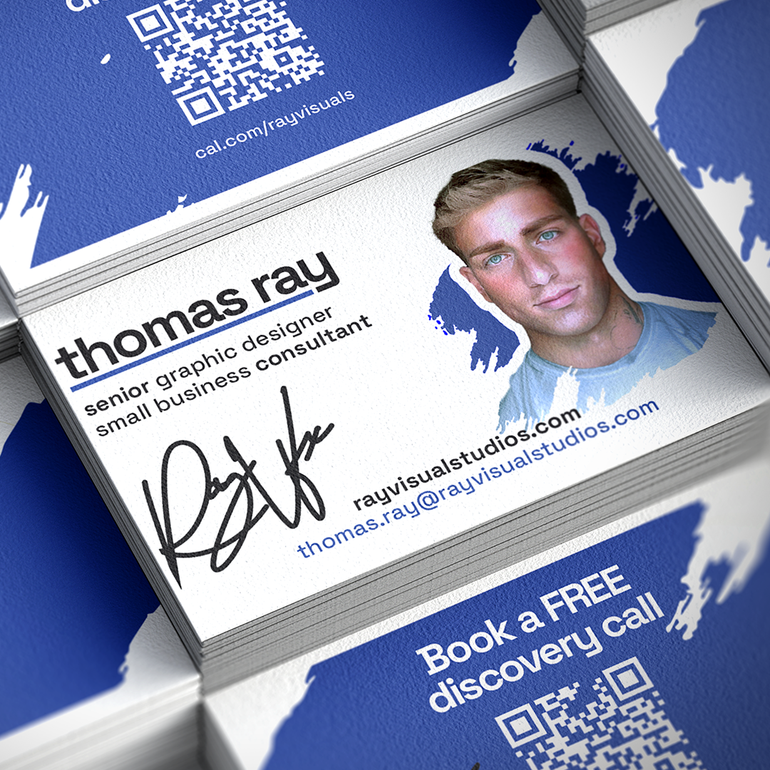 Business card for Thomas Ray, a senior graphic designer and small business consultant, with a professional headshot, contact information, and a QR code. The card features a blue and white color scheme with a splash design.