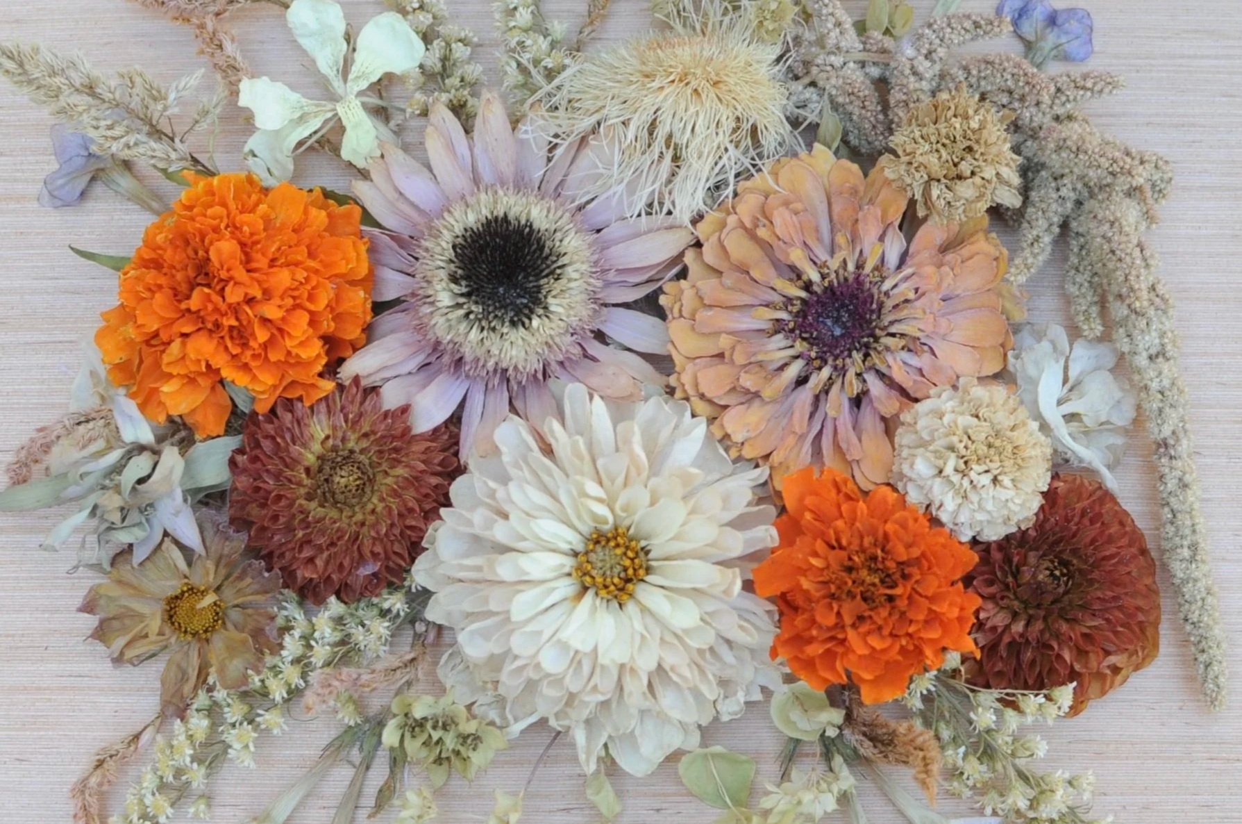 Arrangement of dried flowers on a wooden surface. Preserved wedding bouquet.