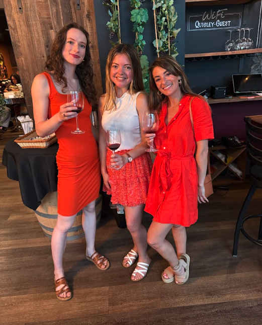 Three friends in red at Lets Go Girls Events