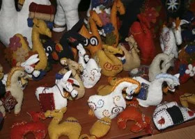 Collection of handmade Christmas sock snowmen and festive decorations.