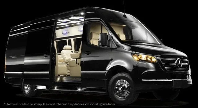 Black Mercedes-Benz Sprinter van with open sliding door, beige interior seats, and interior lighting