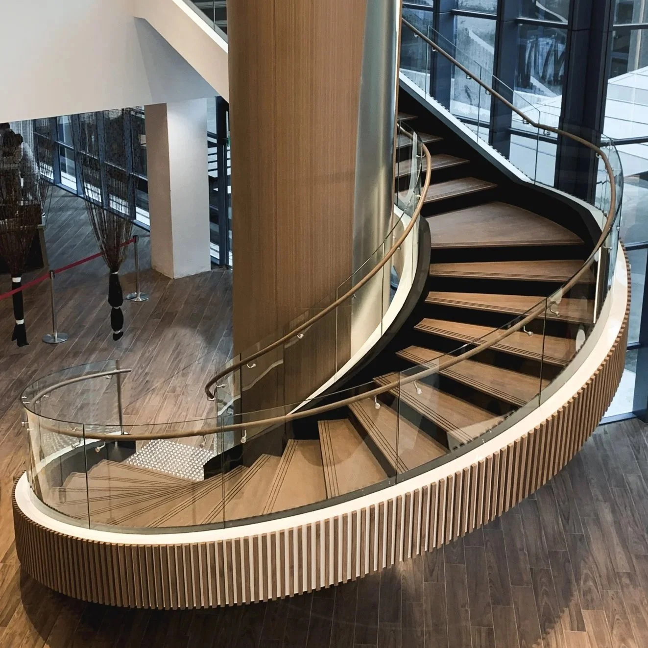 Onewood Spiral Timber Staircase Tread and Curved Handrail in commercial project