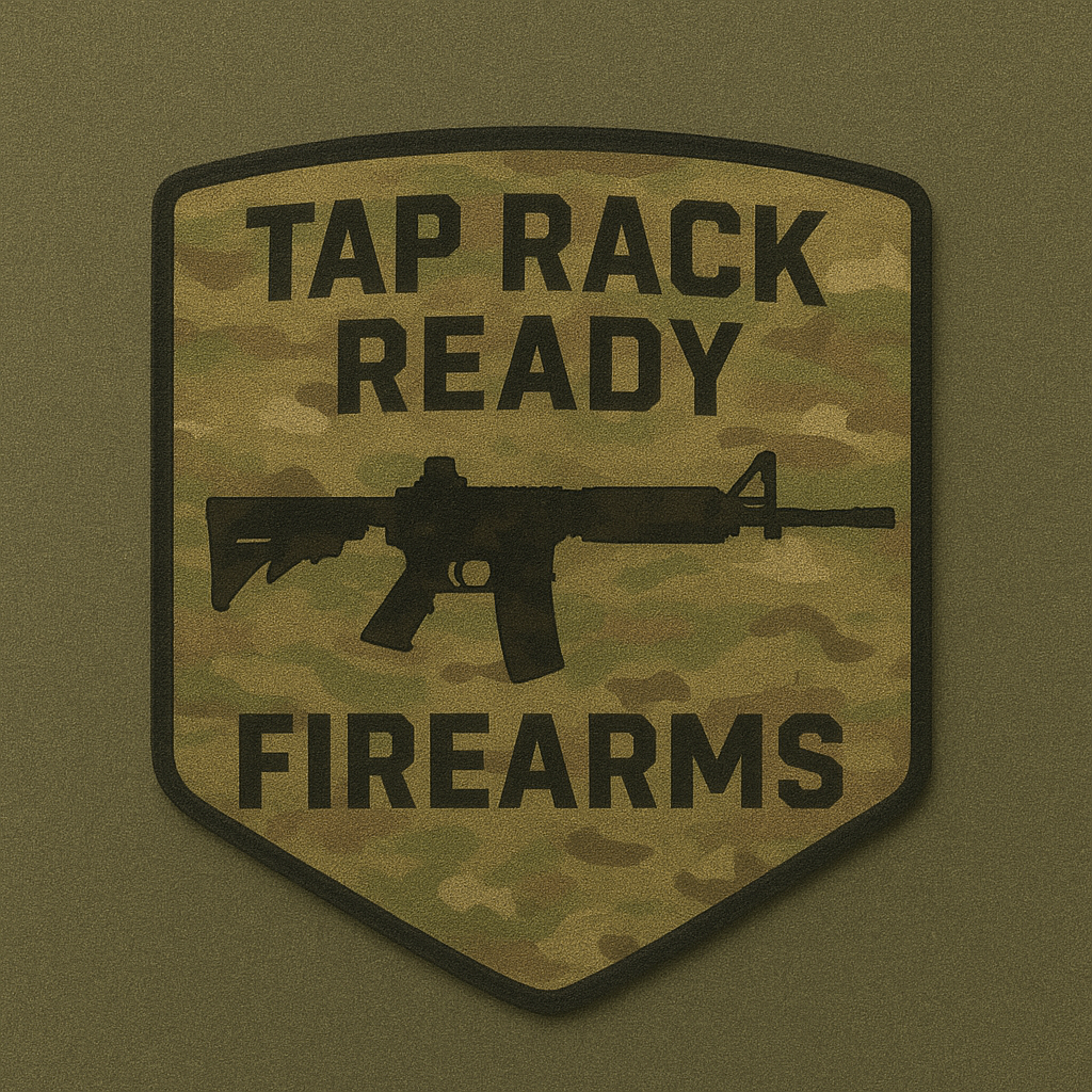 A military-style patch with camouflage background, showing a silhouette of a rifle, and the words "Tap Rack Ready Firearms" in bold black letters.
