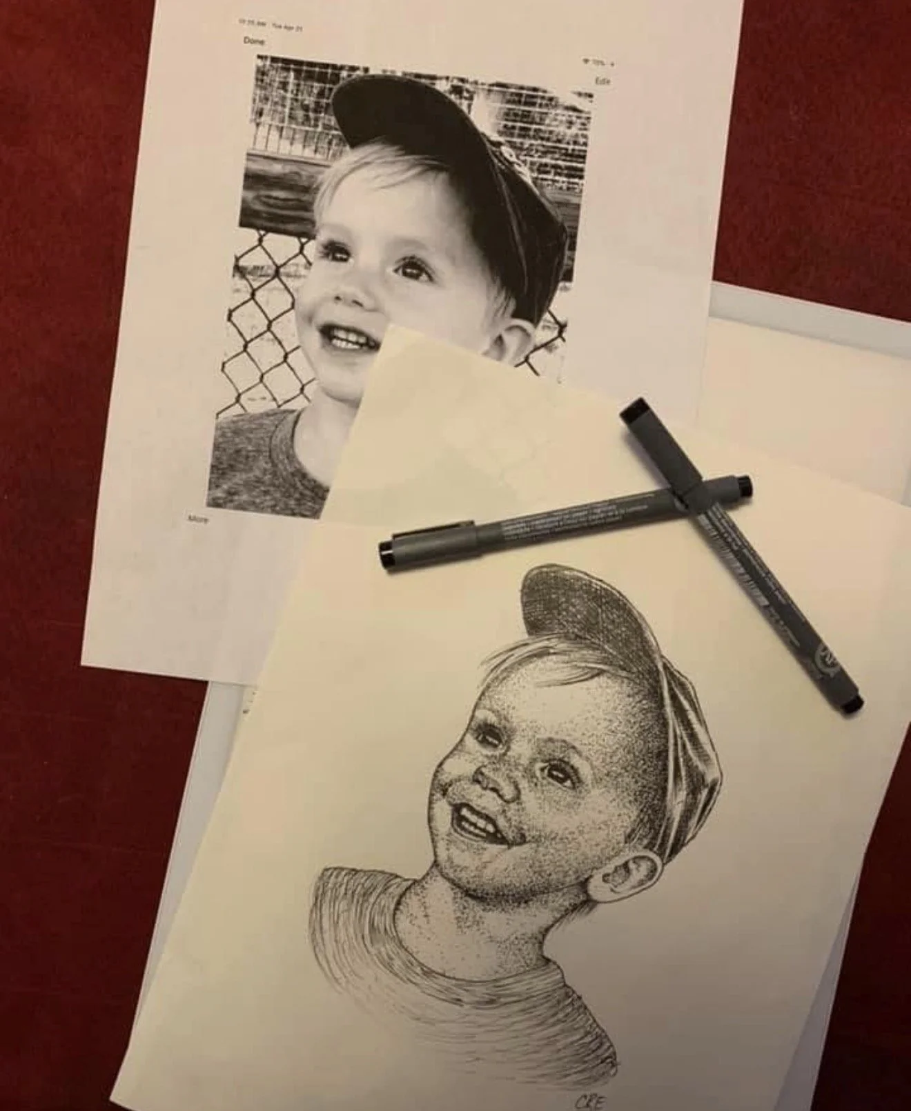 Black and white commissioned drawing of boy with ball cap by Cody Eckenrode