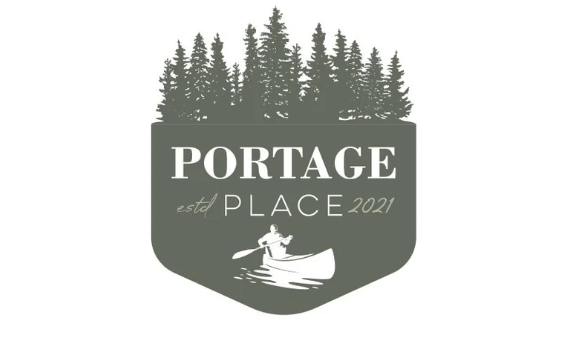 A logo featuring a row of evergreen trees at the top, the text 'PORTAGE' in large letters in the middle, and a person kayaking on water below, with 'estd PLACE 2021' written alongside.