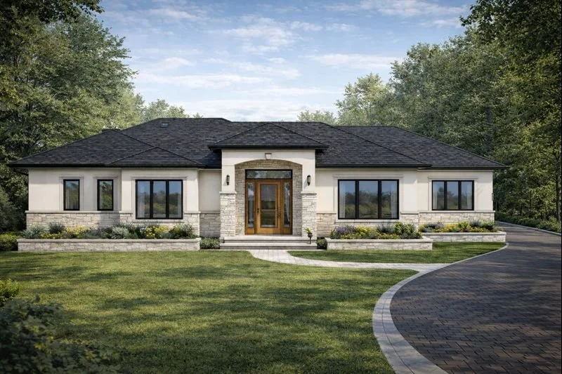 Modern single-story house with a stone and stucco exterior, surrounded by a well-manicured lawn and trees, with a curved driveway leading to the front entrance.