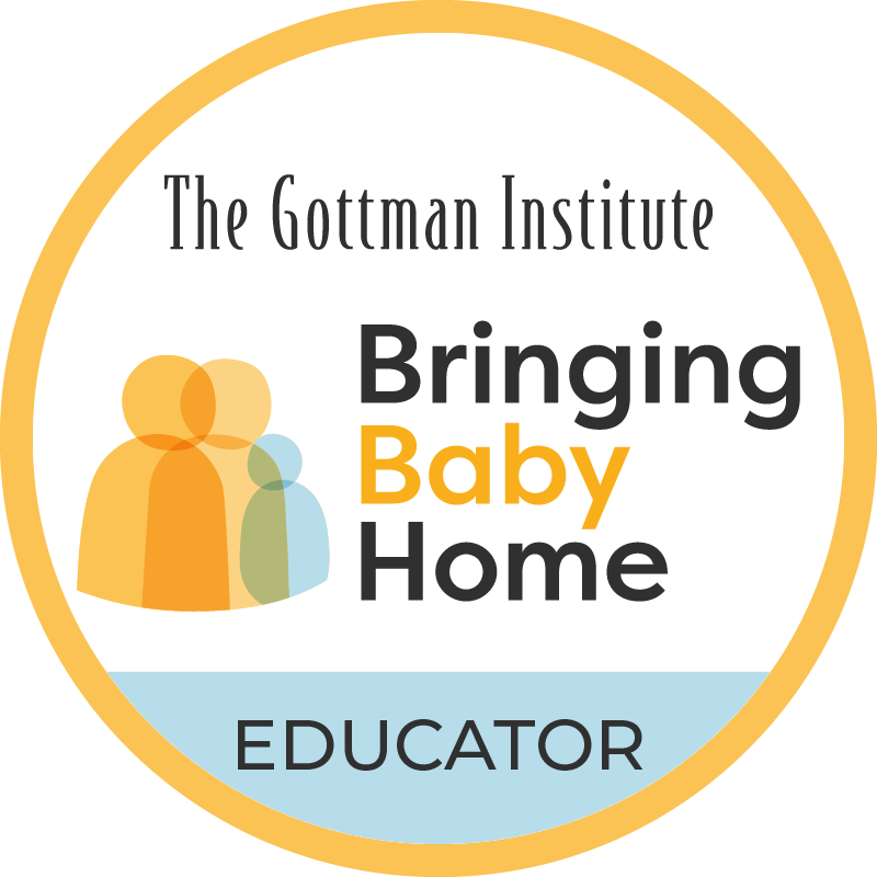 Badge with text 'The Gottman Institute Bringing Baby Home Educator' and an abstract icon of two overlapping figures in orange, yellow, green, and blue, with a light blue band at the bottom.