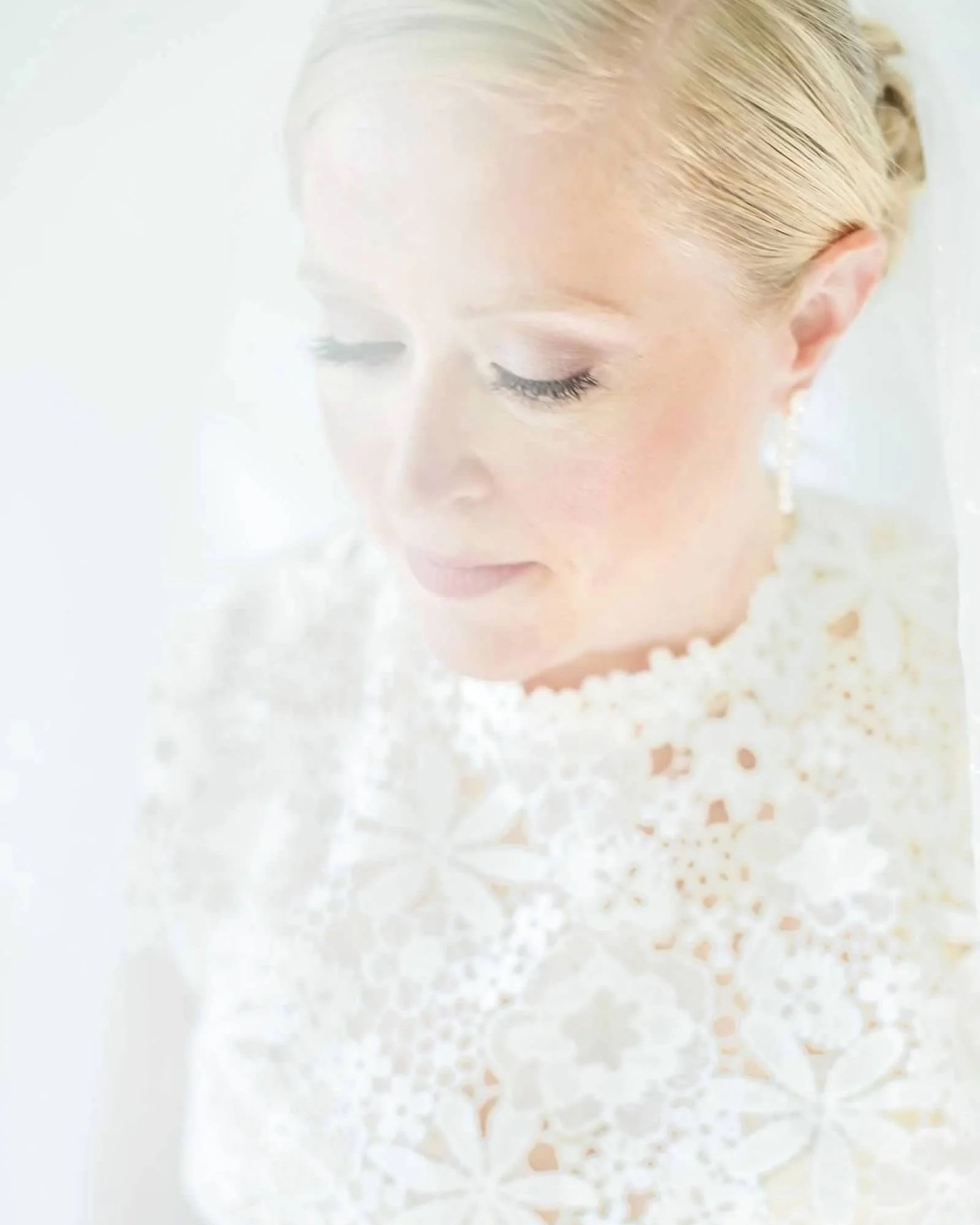 Close-up of a bride wearing soft, natural bridal makeup by a Fort Wayne makeup artist.
