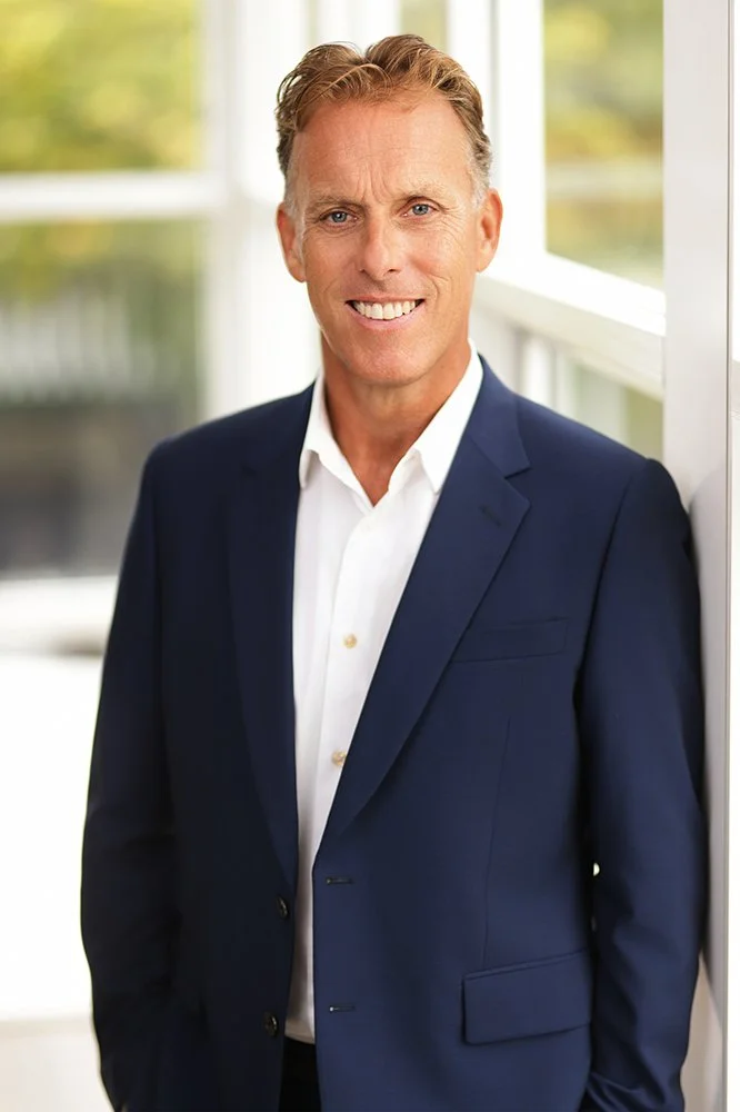	
Adam Kingston, Director and Principal Mortgage Broker of Best Foot Forwards Mortgage Solutions, is Smiling, wearing a blue suit and white shirt standing outdoors. 