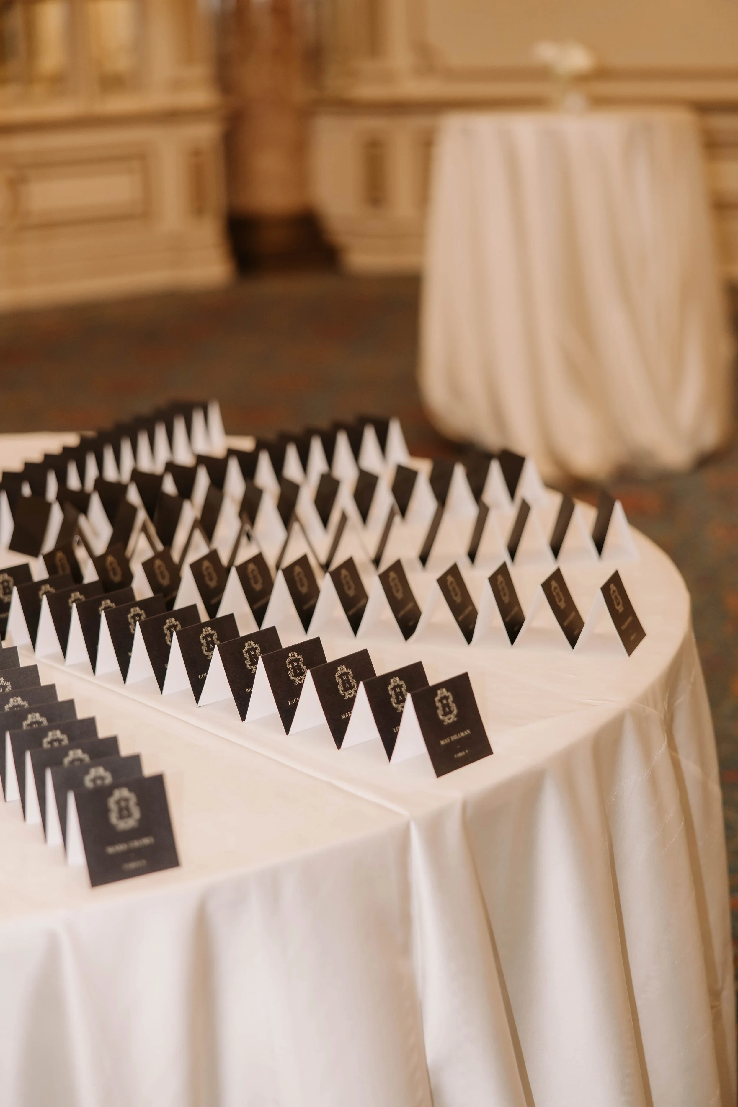gold and black wedding escort card seating display at the fairmont copley plaza