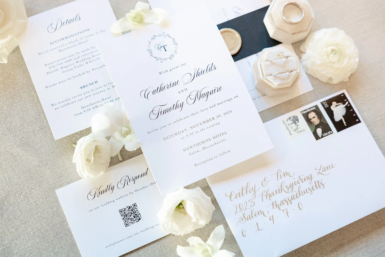 Custom black tie wedding invitation with vintage stamps and belly band and wax seal at The Hawthorne Hotel
