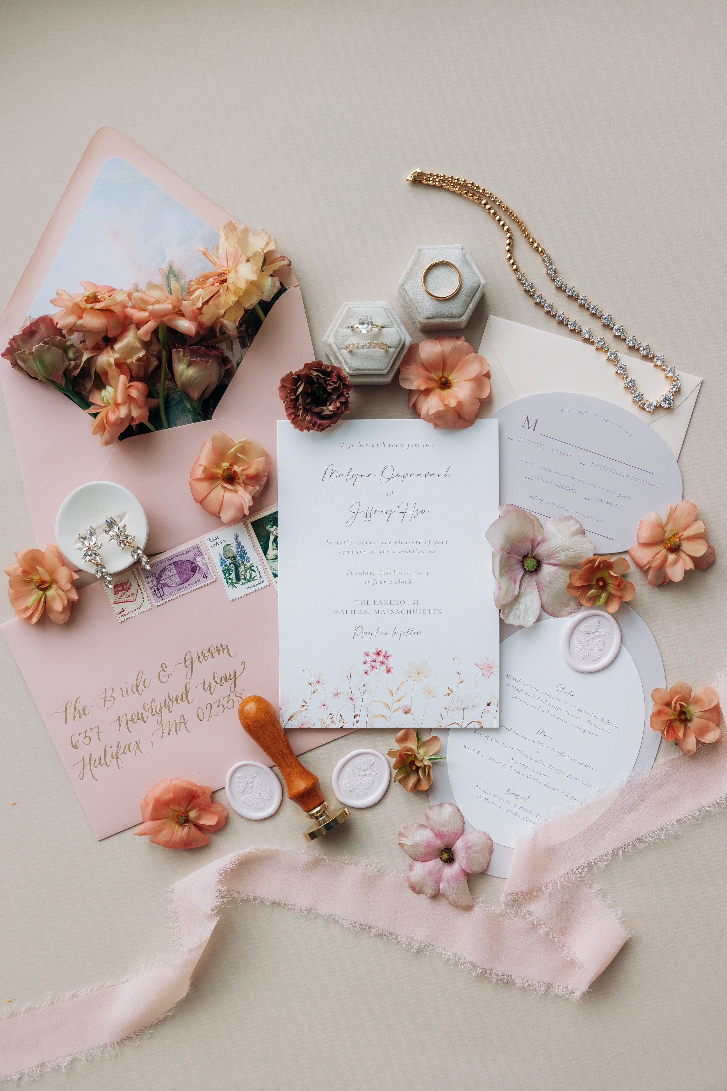 Custom pink wedding invitation with vintage stamps at The Lakehouse