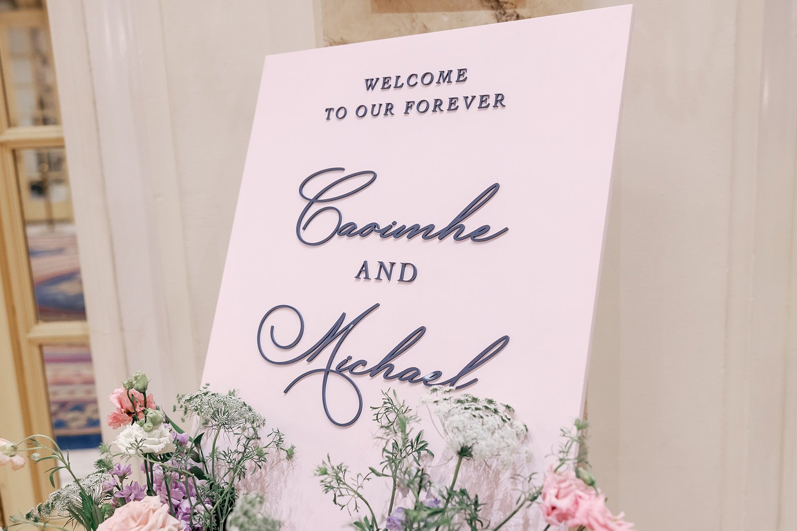 Custom wooden floral welcome sign with 3D acrylic lettering for Boston wedding reception at Fairmont Copley Plaza