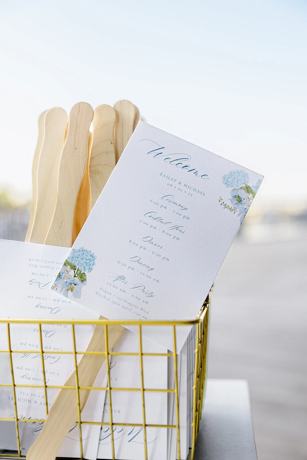 Custom fan wedding ceremony program with hydrangeas for a classic, elegant coastal wedding at the ICA in Boston, MA