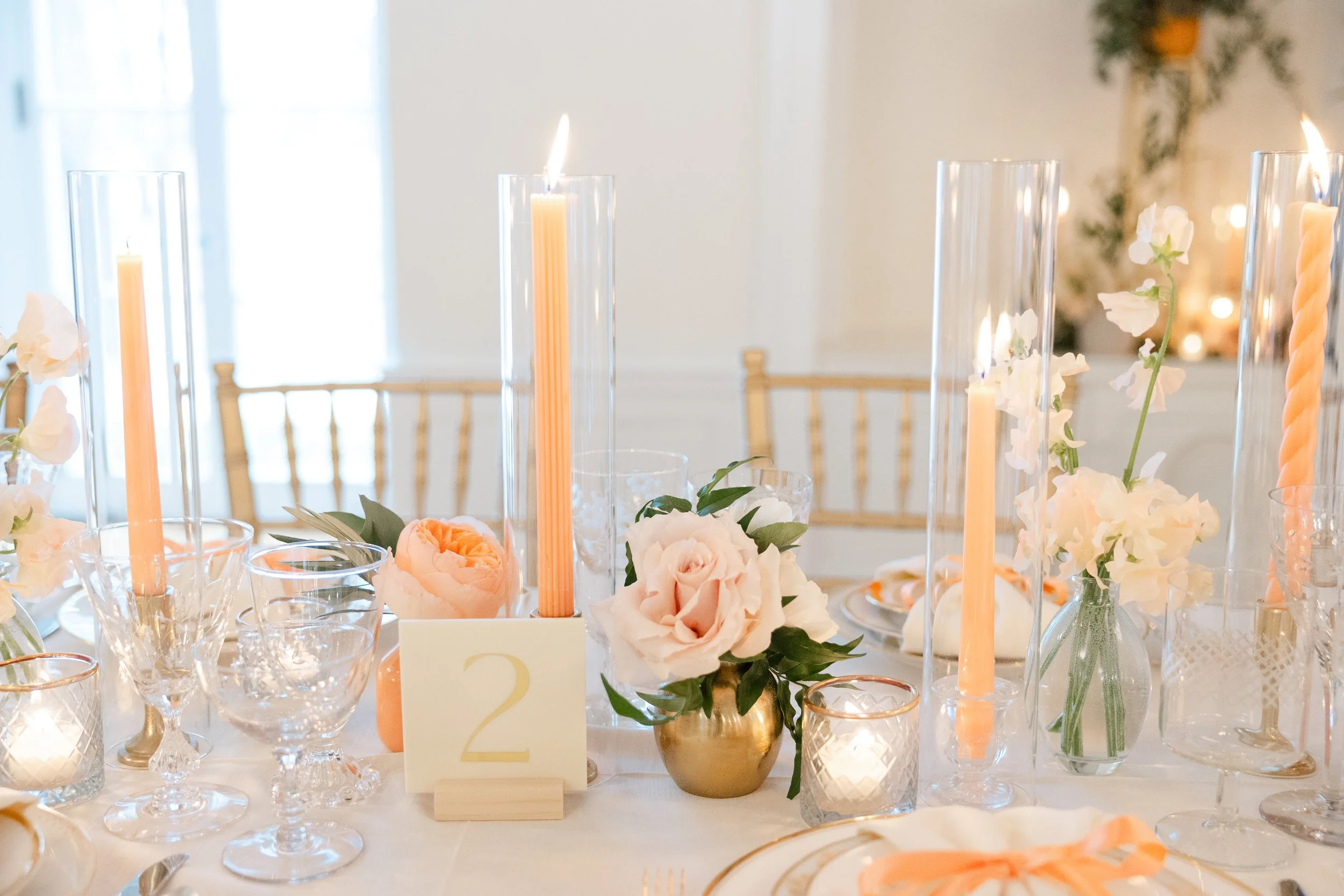 Modern cream acrylic table number with gold vinyl lettering for a peach and pink wedding at Floriana in Ipswich, MA