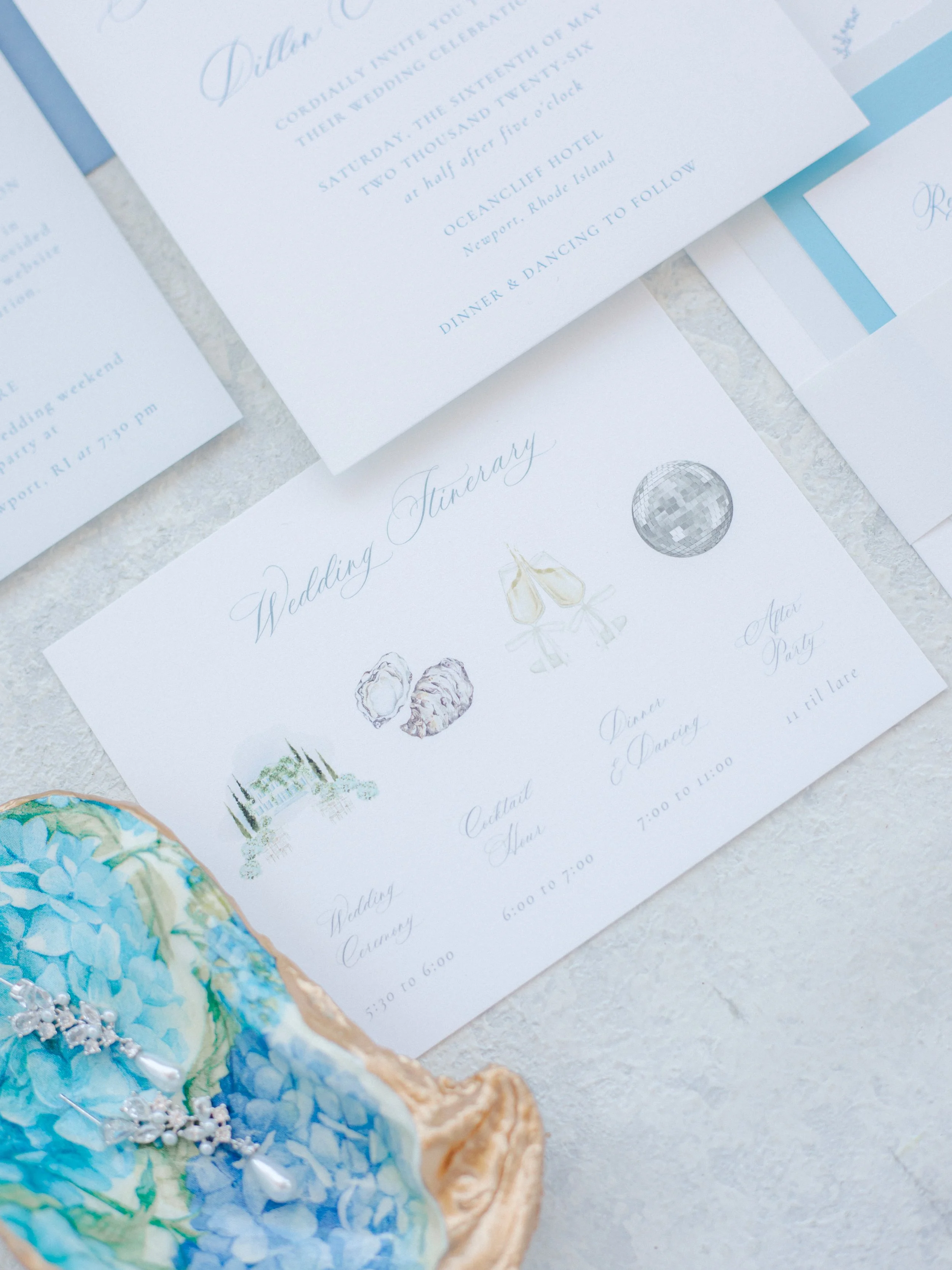 Watercolor wedding itinerary for an invitation suite at OceanCliff Hotel