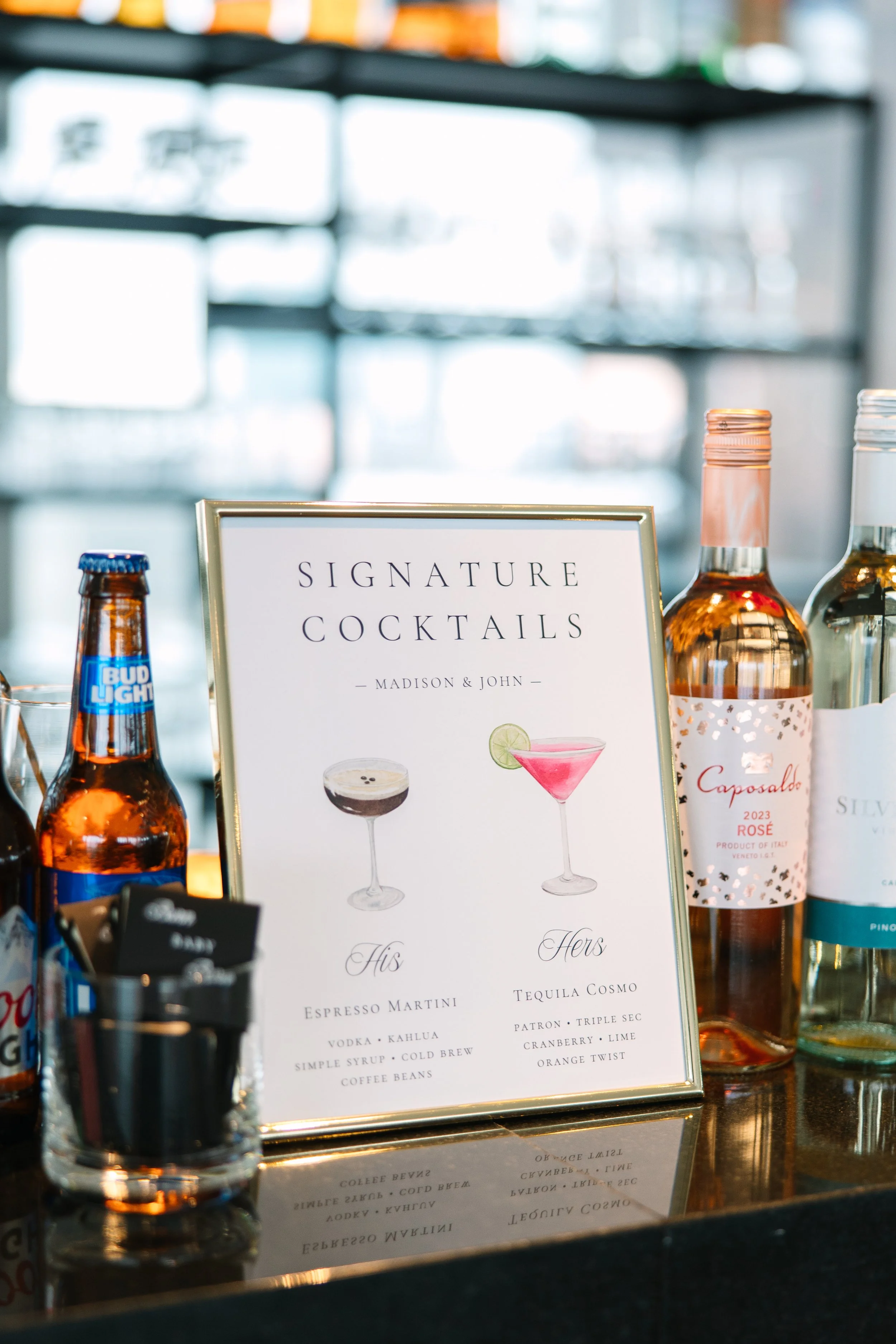 Personalized black and white wedding signature cocktail sign on luxury card stock featuring a modern elegant layout at a Boston wedding reception - State Room