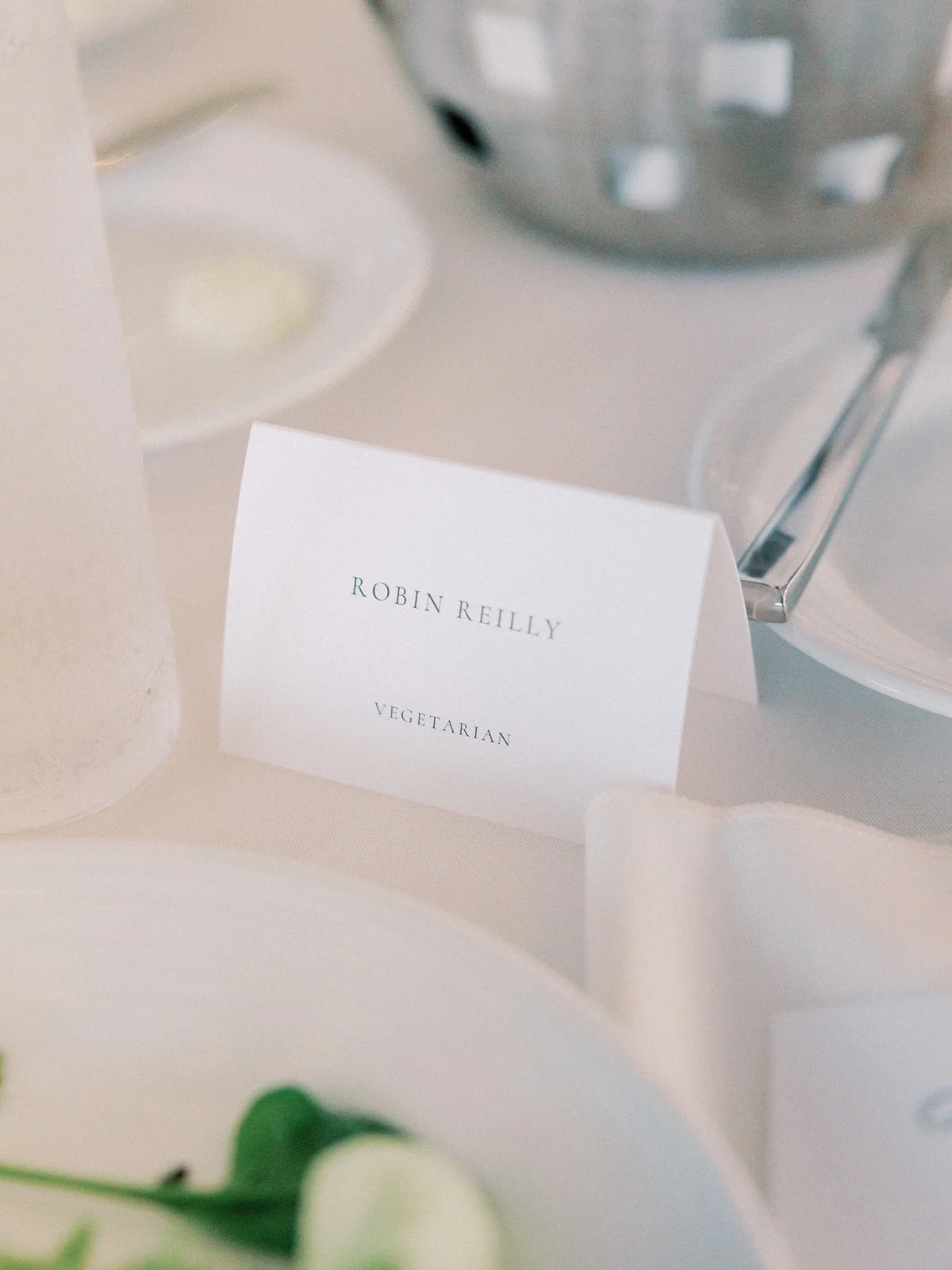Personalized wedding dinner place card on luxury card stock featuring a modern elegant layout at a Boston wedding reception - New England Aquarium