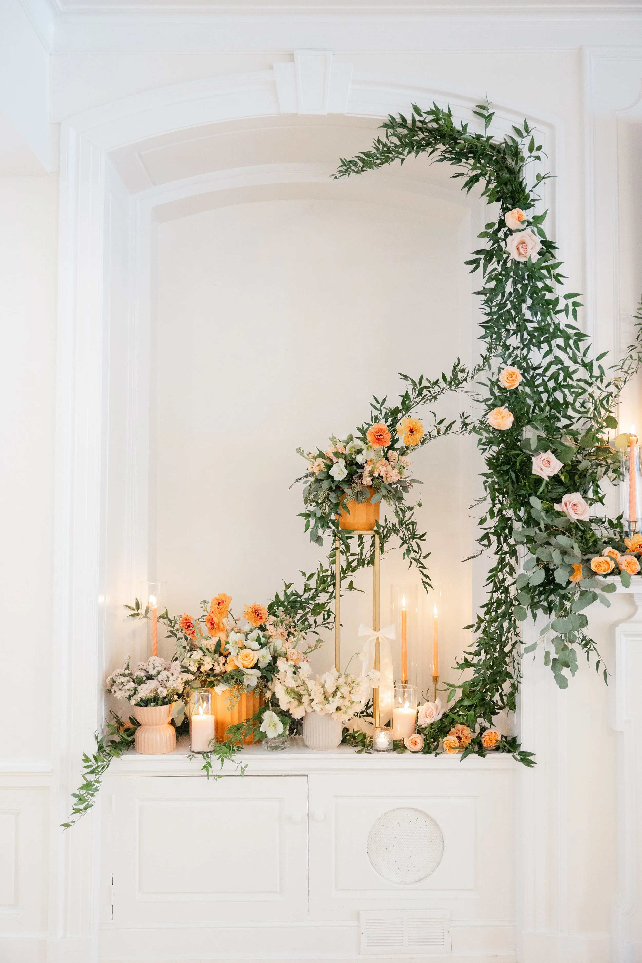 Custom, modern floral and candle display for a peach and pink wedding at Floriana in Ipswich, MA
