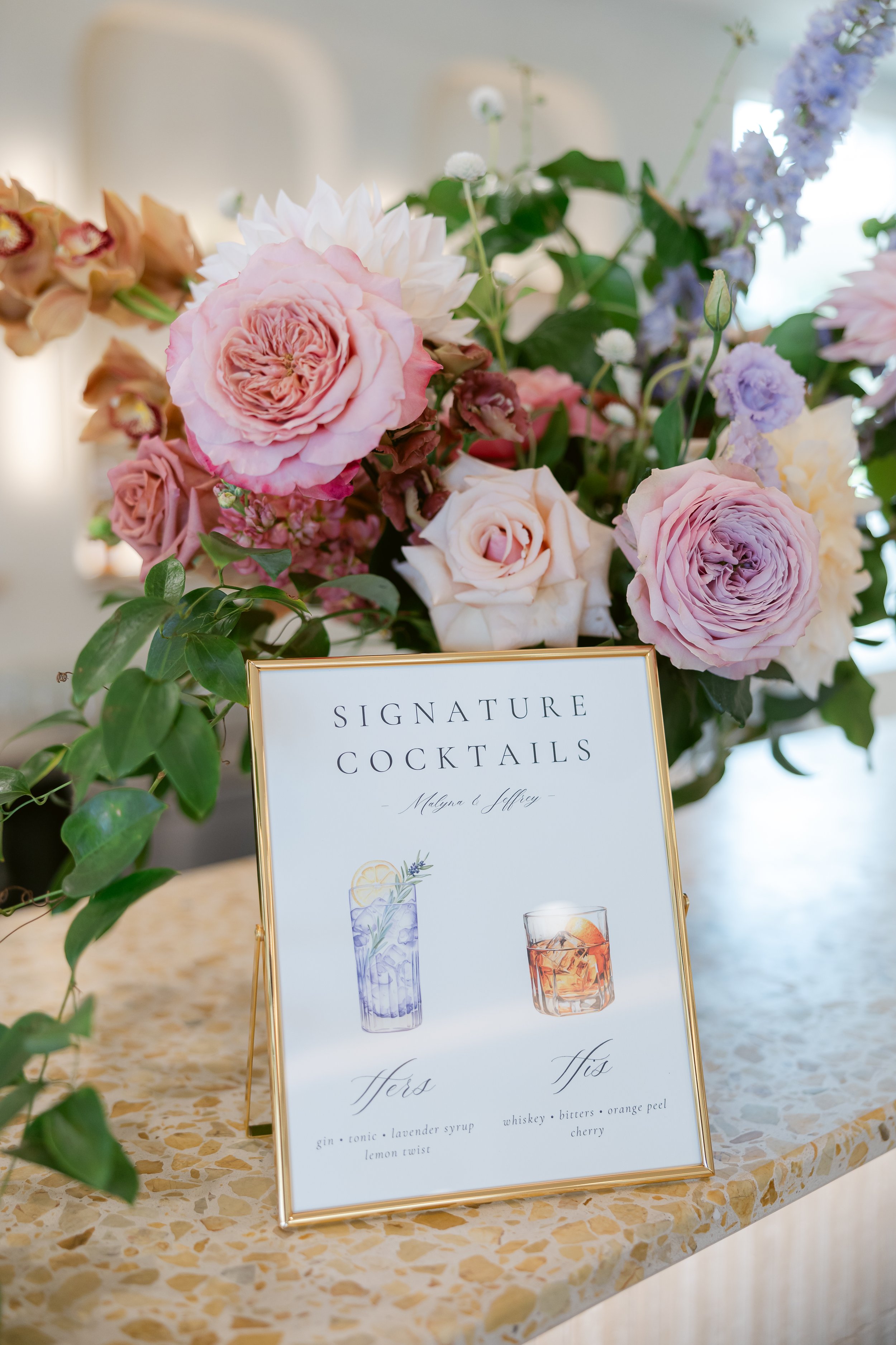 Custom signature cocktail sign on card stock in a gold frame with watercolor cocktail artwork for an elegant wedding at The Lakehouse in Halifax, MA