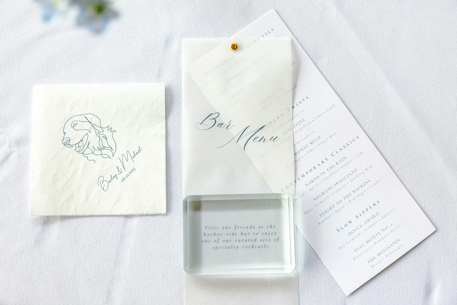 Custom bar menu on luxury card stock with vellum overlay with dusty blue ink for a classic, elegant coastal wedding at the ICA in Boston, MA